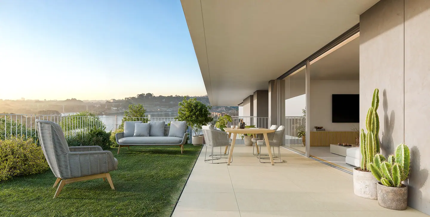 Private terrace with a garden, armchairs and a dining table, open to the river view