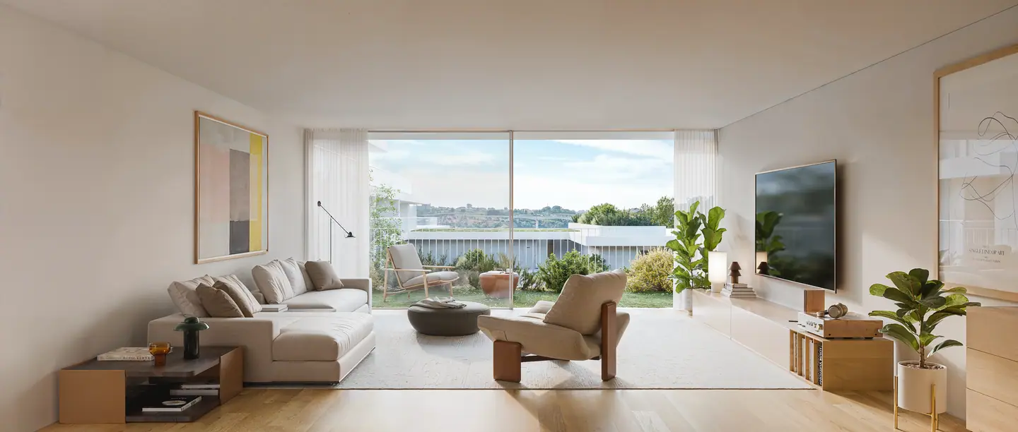 Bright living room with a sofa and a wide window onto the garden