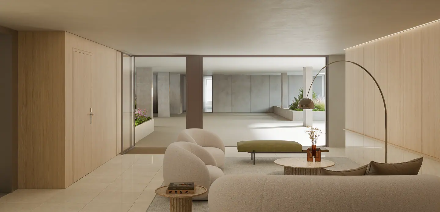 Spacious lounge with light wood walls and soft seating