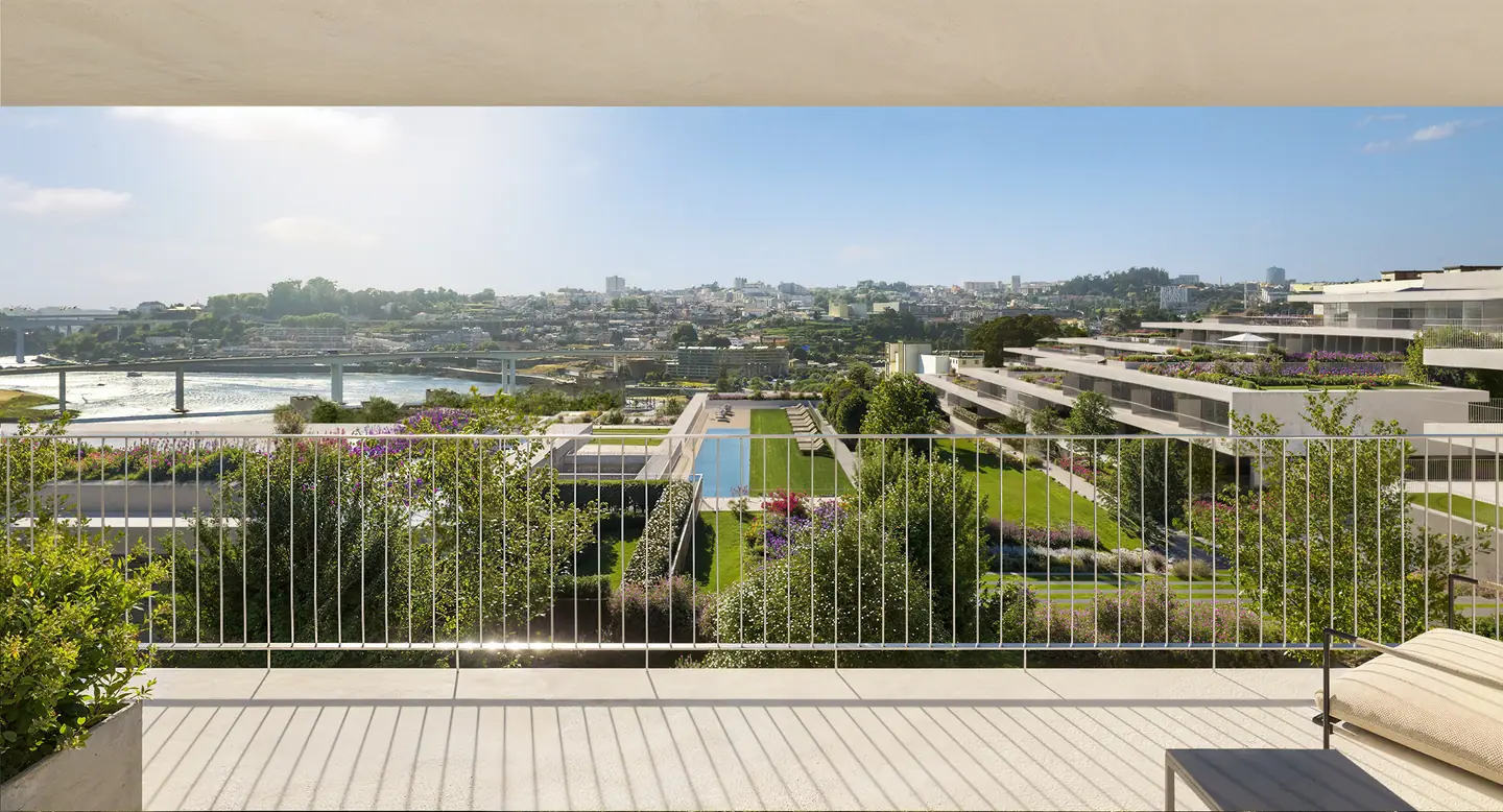View from a balcony over the gardens, the pool and the river