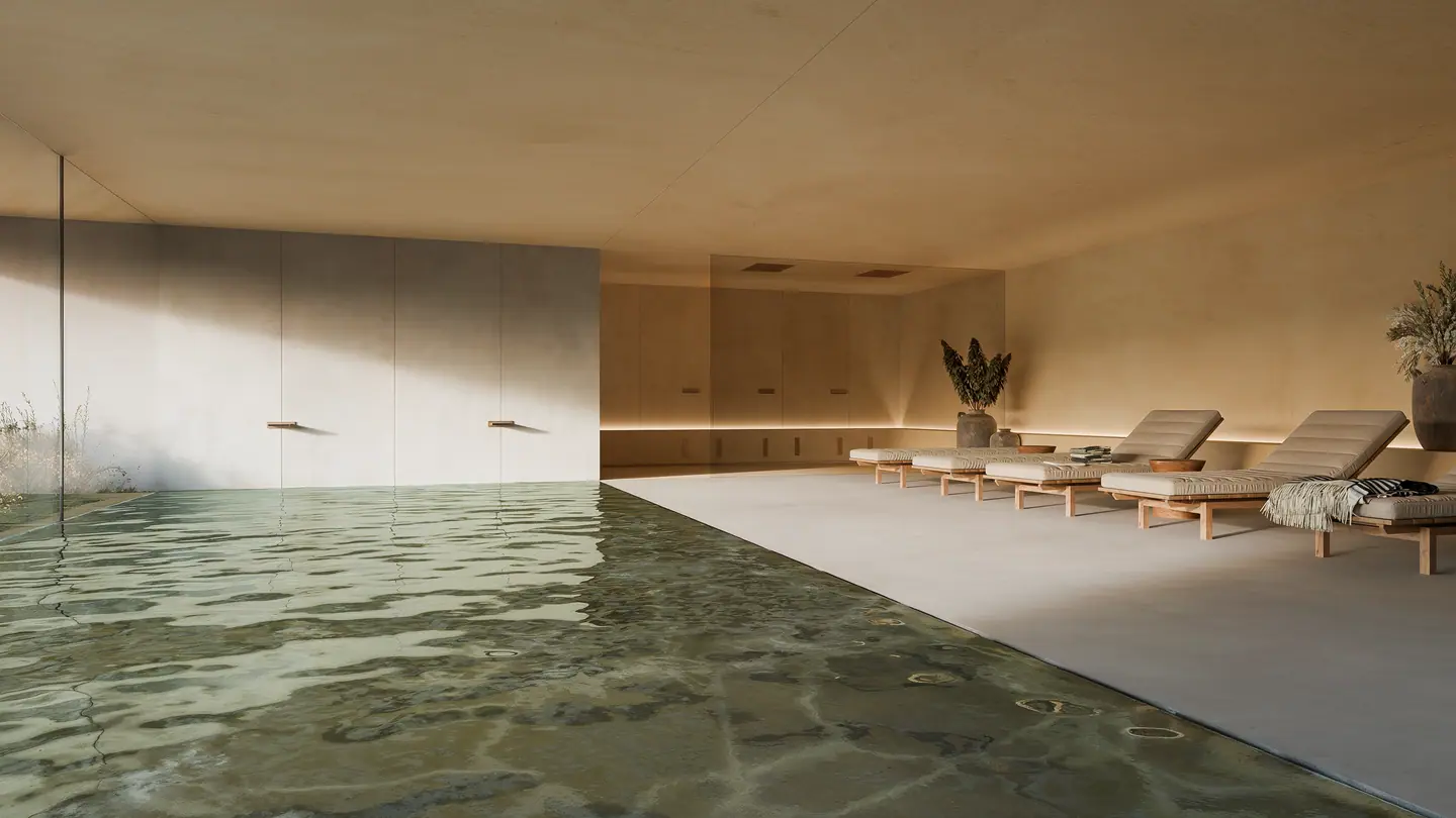 Indoor pool with loungers in a calm spa space